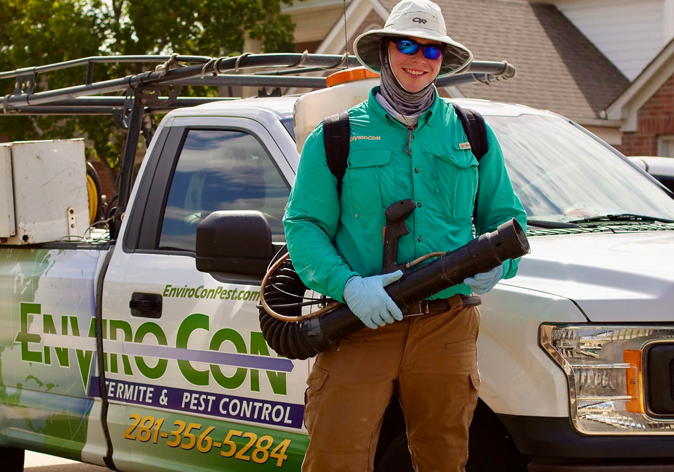 Envirocon tech standing in front of truck